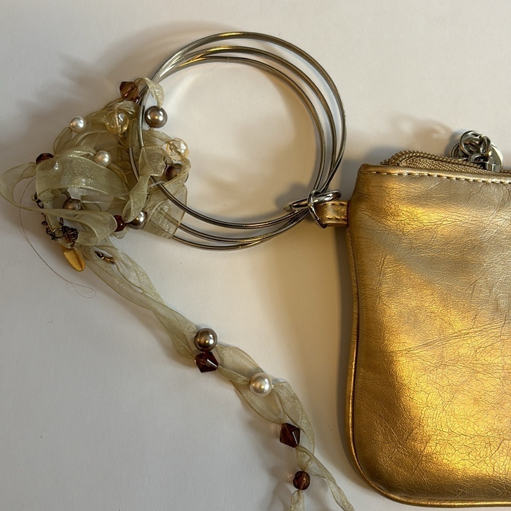 NY&CO GOLD WRISTLET WITH 3 RINGS AS WRISTLET HAS RIBBON DEATTACHABLE ADORNMENT - Picture 6 of 6